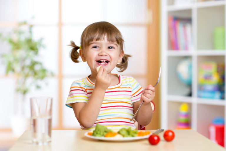 A happy child eating