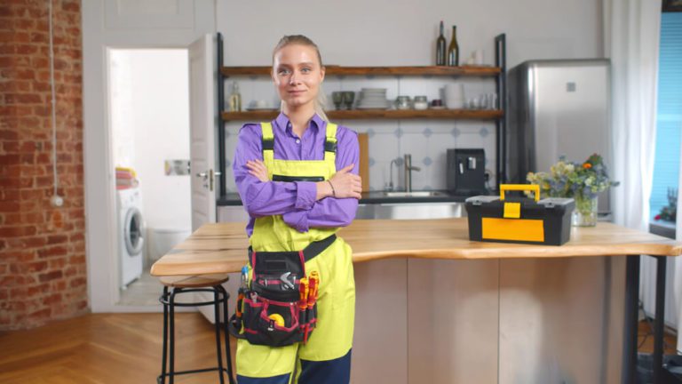 A female plumber standing