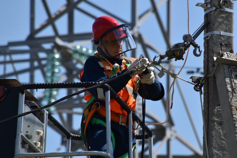 Male electrician fixing a cable